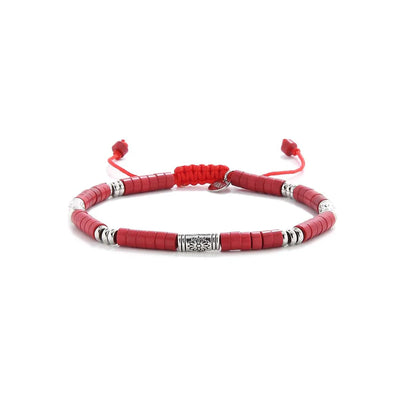 mens red bracelet shown in full view with red clay beads with engraved silver spacers and adjustable cord
