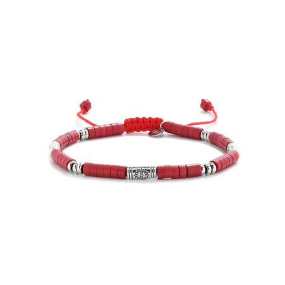 mens red bracelet shown in full view with red clay beads with engraved silver spacers and adjustable cord