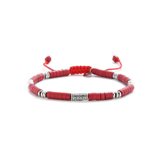 mens red bracelet shown in full view with red clay beads with engraved silver spacers and adjustable cord