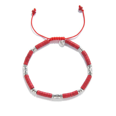 mens red bracelet shown from above with red clay beads with engraved silver spacers and round bracelet shape