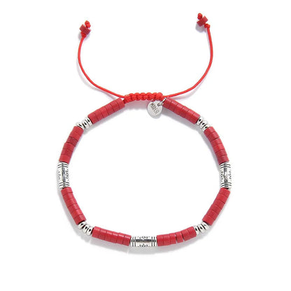 mens red bracelet shown from above with red clay beads with engraved silver spacers and round bracelet shape