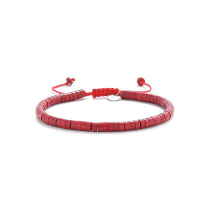 Mens Red String Bracelet shown in full view with red clay beads with silver charm and adjustable cord
