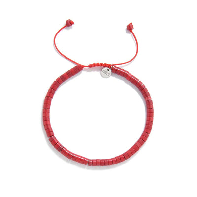 Mens Red String Bracelet shown from above with red clay beads with silver charm and round bracelet shape