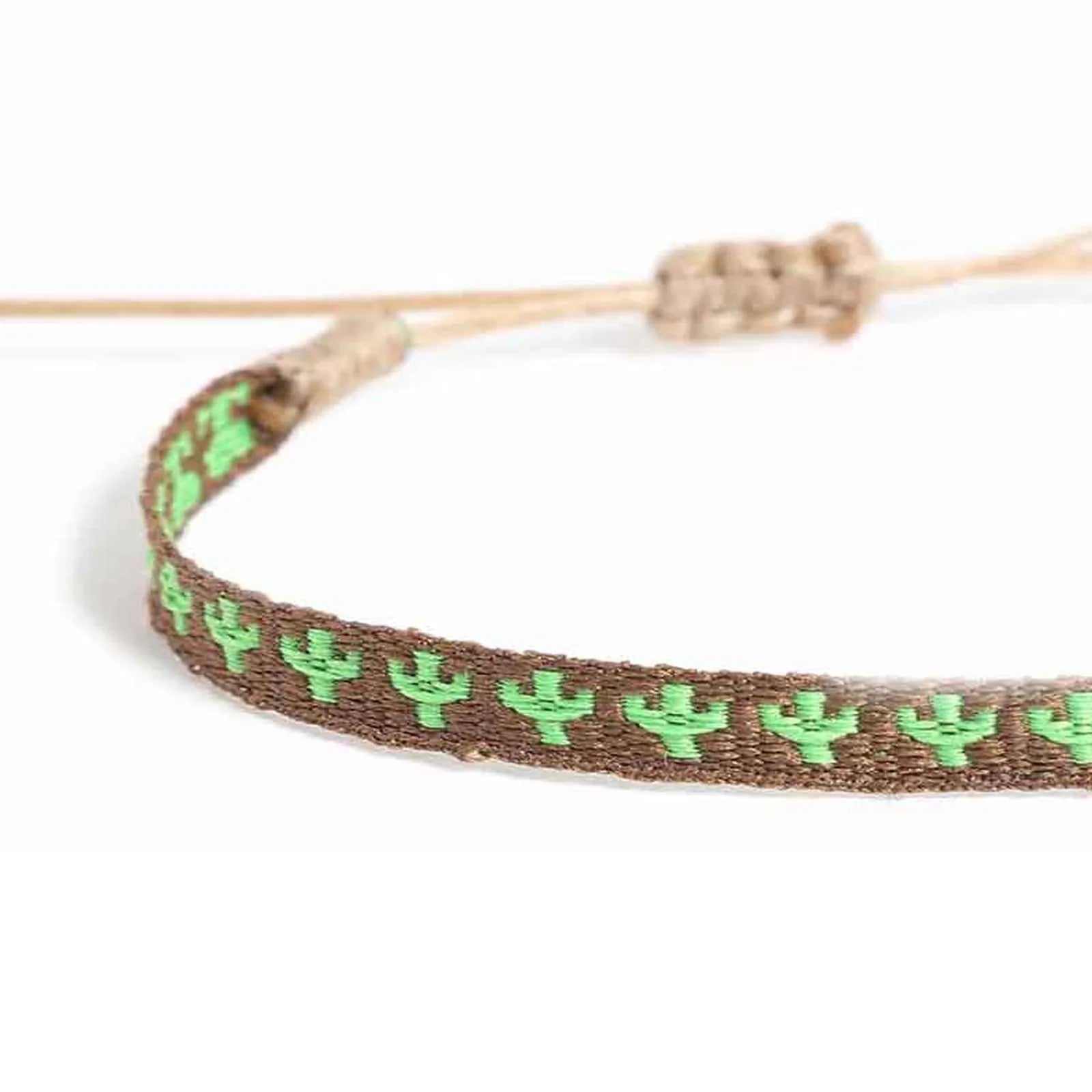 Detailed view of mens rope bracelet texture with green cactus embroidery on brown woven cord