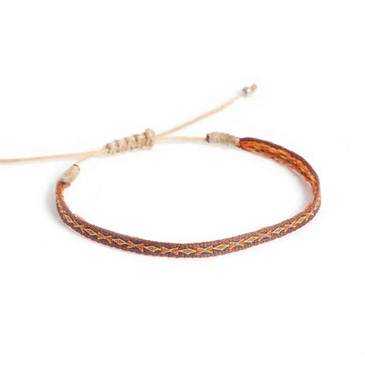 Mens Rope Bracelets shown from above with brown patterned band and sliding knot cord closure