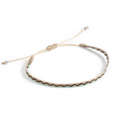 Men's Rope Bracelets shown from above with cream woven band and sliding knot cord closure