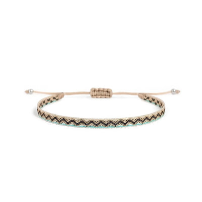 Men's Rope Bracelets style in cream with black zigzag pattern, turquoise edge, and bead ends