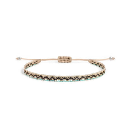 Men's Rope Bracelets style in cream with black zigzag pattern, turquoise edge, and bead ends