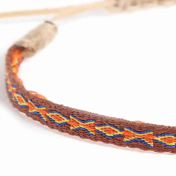 Detailed view of Mens Rope Bracelets texture with brown cord, orange pattern, and yellow stitching