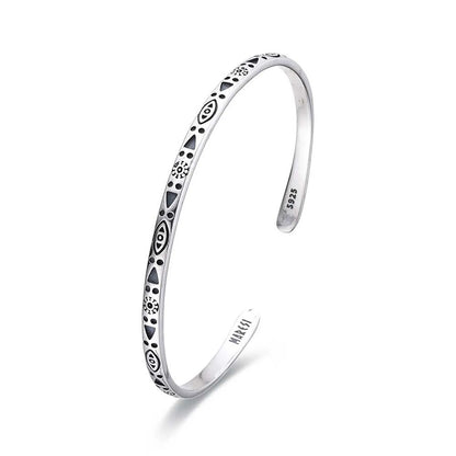 Mens Stainless Steel Bracelets shown in angled profile with geometric symbols and open cuff ends