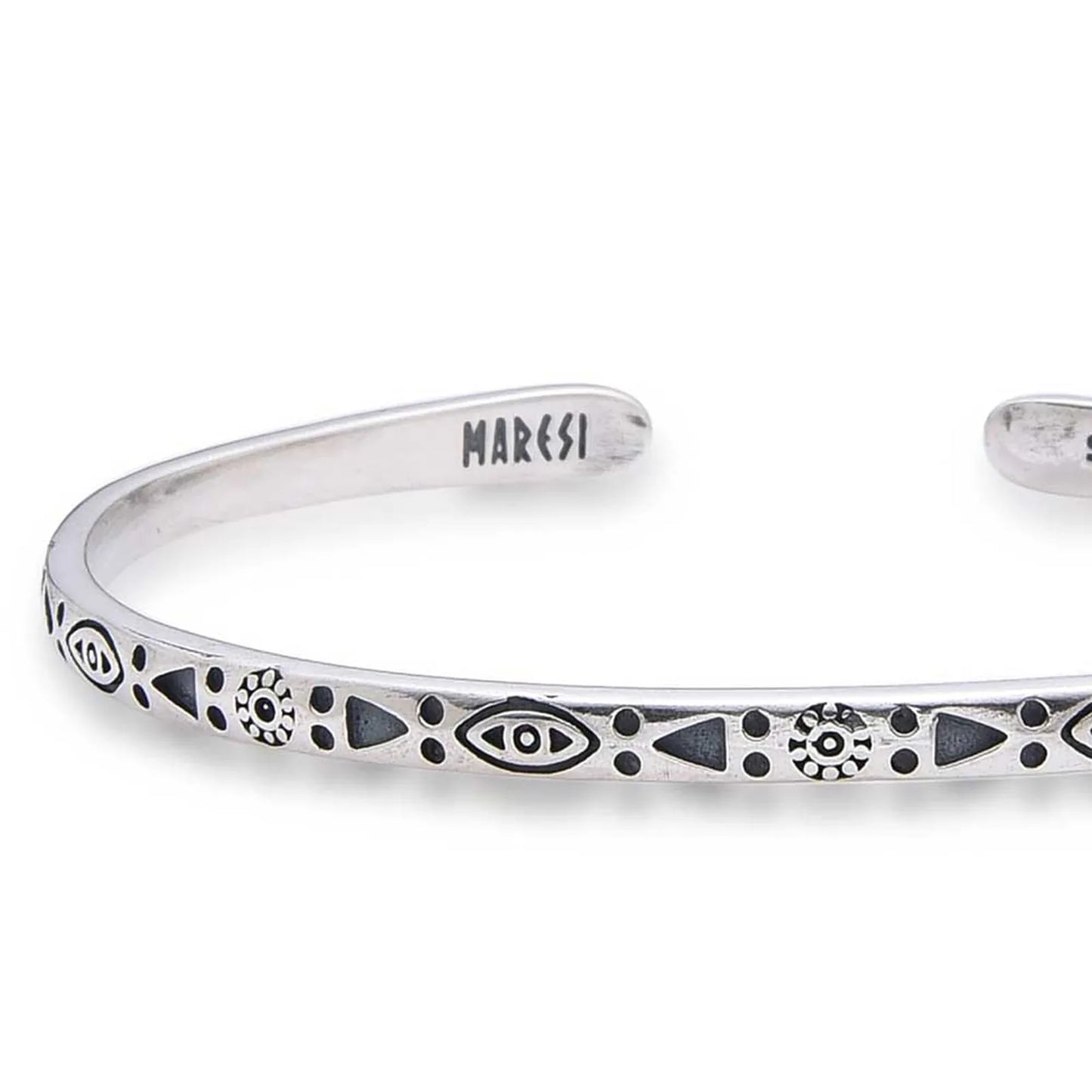 Close-up of Mens Stainless Steel Bracelets with eye, sun, triangle, and dot engravings