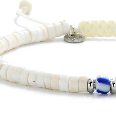Detailed view of Mens White Bracelet with white clay beads with blue accent bead, Santorini clay bead texture, and cord knot