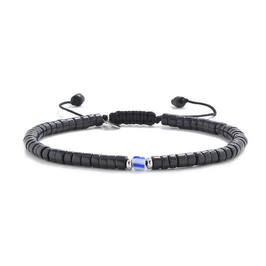 Straight-on product photo of mens black pearl bracelet with center blue bead
