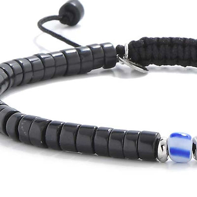 Close view of mens black pearl bracelet with black clay beads and blue center bead