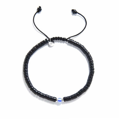 Top view of mens black pearl bracelet showing full circle and adjustable cord