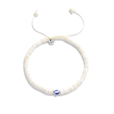 Top-down view of mens white bracelet with round white beads and Santorini blue accent bead

