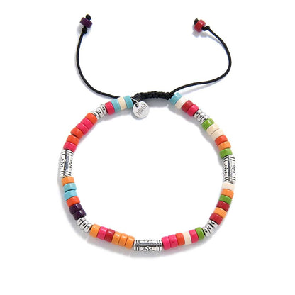 Top view of circular multicolored beaded bracelet with adjustable cord