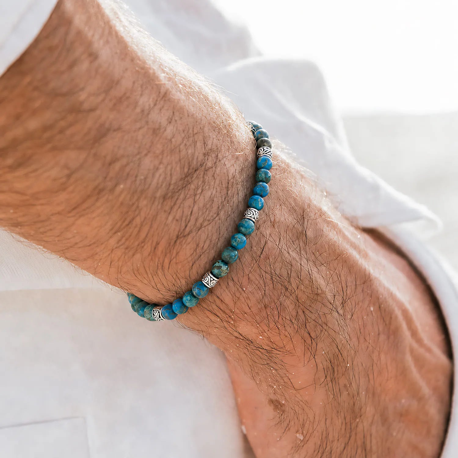 Ocean Jasper Blue Bracelet worn on a wrist with a white shirt