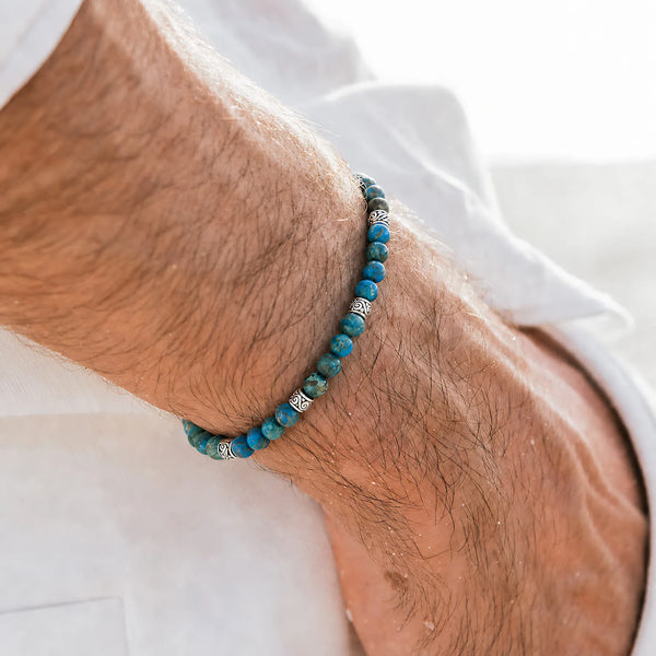 Ocean Jasper Blue Bracelet worn on a wrist with a white shirt