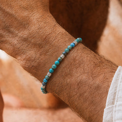Ocean Jasper Blue Bracelet worn on a wrist with beaded design and adjustable cord