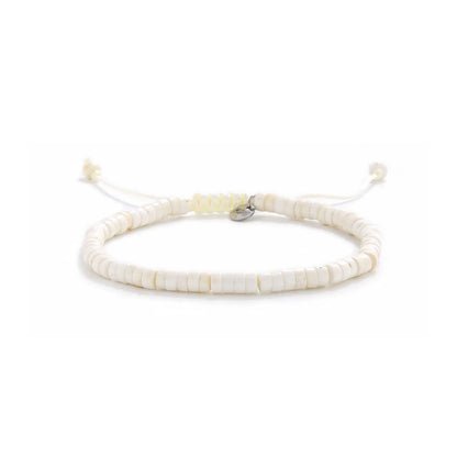 Off White Bracelet shown in full view with off white clay beads with blue accent bead and adjustable cord