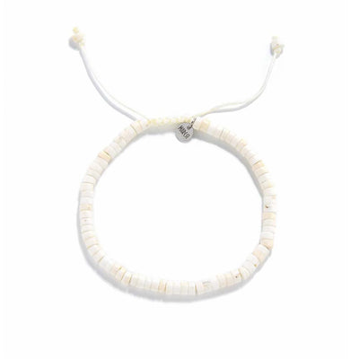 Off White Bracelet shown from above with off white clay beads with blue accent bead and round bracelet shape