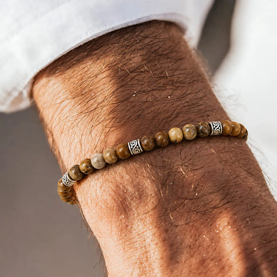 Picture Jasper Bracelet worn on a wrist with beaded design and adjustable cord