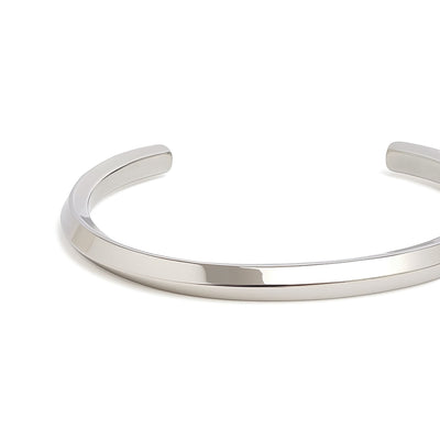 Polished and modern stainless steel bracelet for men displayed against white background