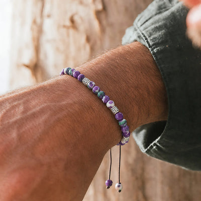 Purple Jasper Bracelet worn on a wrist with beaded design and adjustable cord