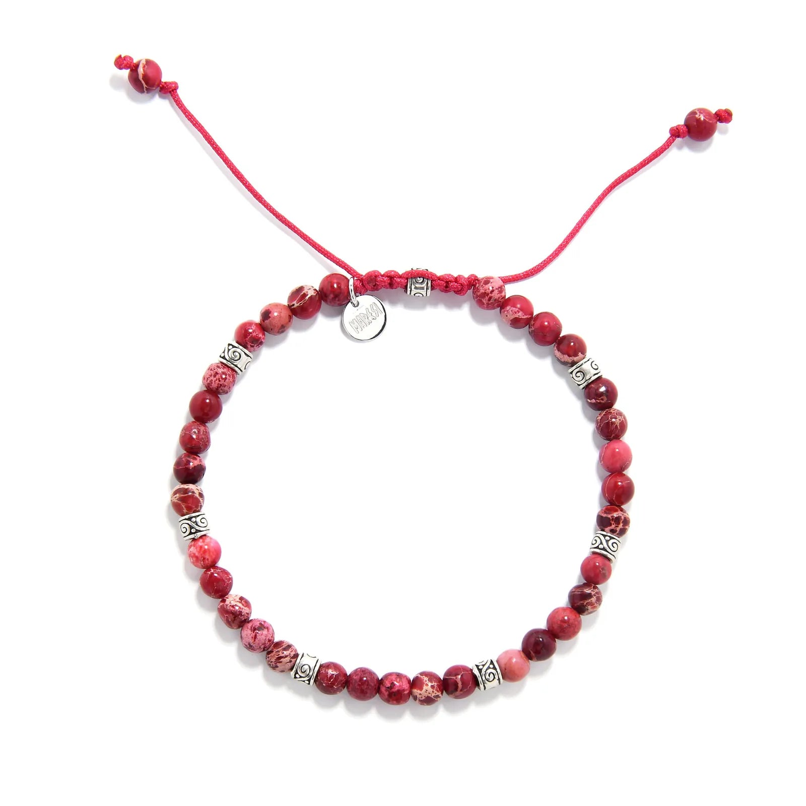 Top view of Red Jasper Bracelet with round red beads, silver spacers, red cord, and small charm.