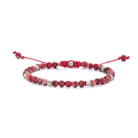 Red Jasper Bracelet full view with red stone beads, silver spacers, and adjustable red cord.