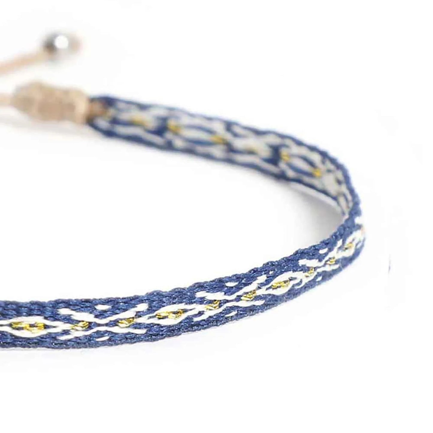 Close-up of Rope Bracelet for Men with blue woven band, white diamond pattern, and gold accents