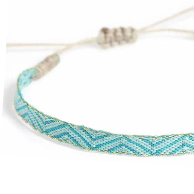 Close-up of Rope Bracelet Mens with turquoise woven band, pale blue chevrons, and gold accents