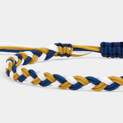 adjustable friendship bracelet close-up showing braided cord texture, adjustable knot, and charm detail