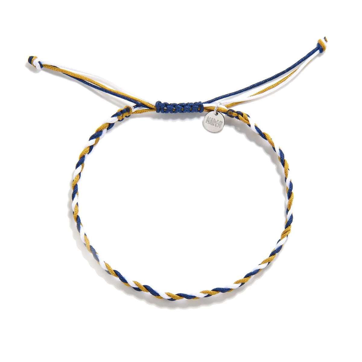 Overhead view of the Sanluri blue and yellow friendship bracelet with white strands, cord tails, and a round Maresi tag.