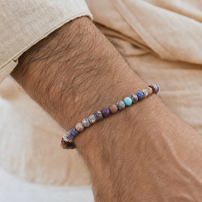 Sea Sediment Jasper Bracelet worn on a wrist with a light sleeve