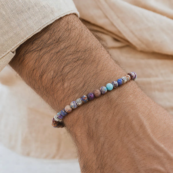 Sea Sediment Jasper Bracelet worn on a wrist with a light sleeve