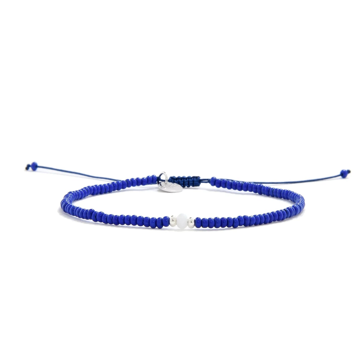 Seed Bead Bracelet Ideas shown in full view with blue seed beads with white accent beads and adjustable cord