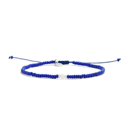 Seed Bead Bracelet Ideas shown in full view with blue seed beads with white accent beads and adjustable cord