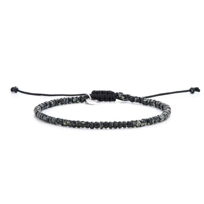 Seed Bead Bracelets shown in full view with black and gray Picasso seed beads and adjustable cord