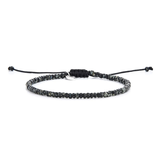 Seed Bead Bracelets shown in full view with black and gray Picasso seed beads and adjustable cord
