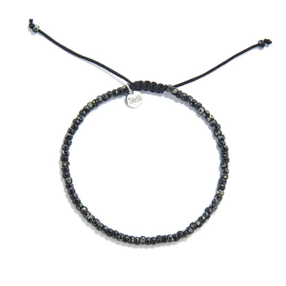Seed Bead Bracelets shown from above with black and gray Picasso seed beads and round bracelet shape