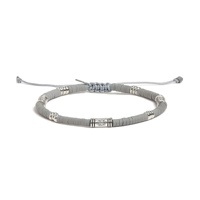 Shamballa Bracelet shown in full view with gray clay beads with engraved silver spacers and adjustable cord