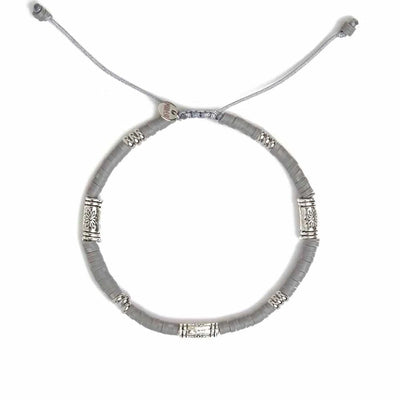 Shamballa Bracelet shown from above with gray clay beads with engraved silver spacers and round bracelet shape