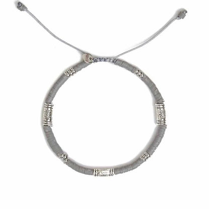 Shamballa Bracelet shown from above with gray clay beads with engraved silver spacers and round bracelet shape