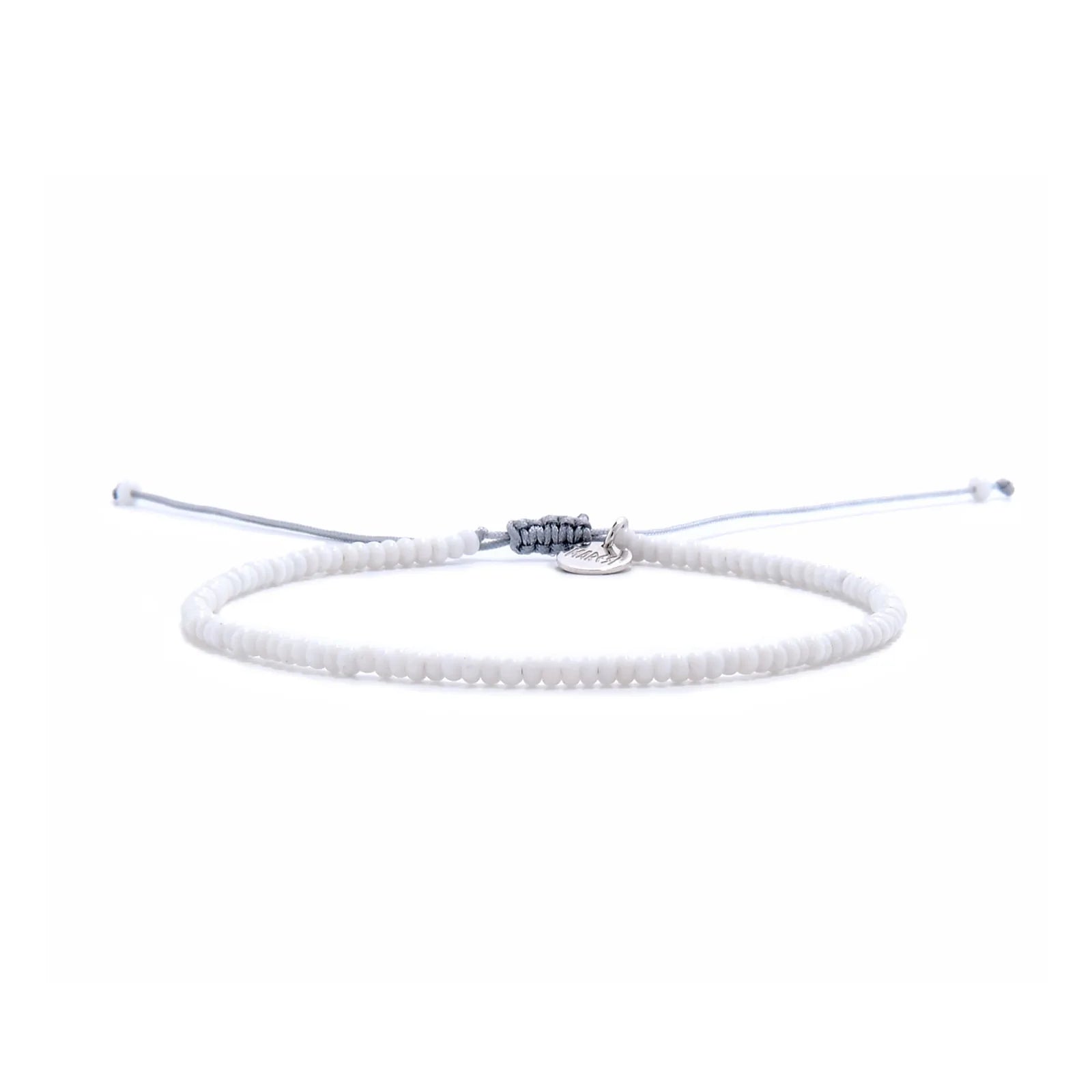 Small Beaded Bracelets shown in full view with white seed beads with gray cord and adjustable cord
