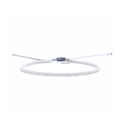 Small Beaded Bracelets shown in full view with white seed beads with gray cord and adjustable cord