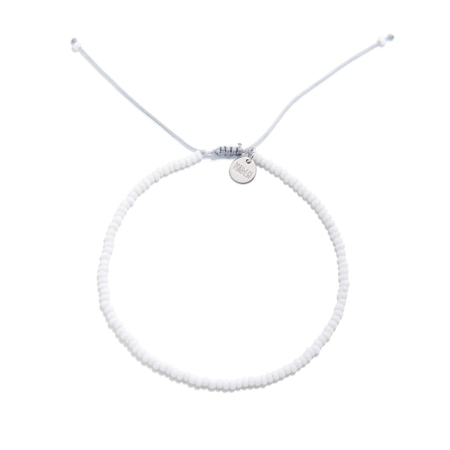 Small Beaded Bracelets shown from above with white seed beads with gray cord and round bracelet shape