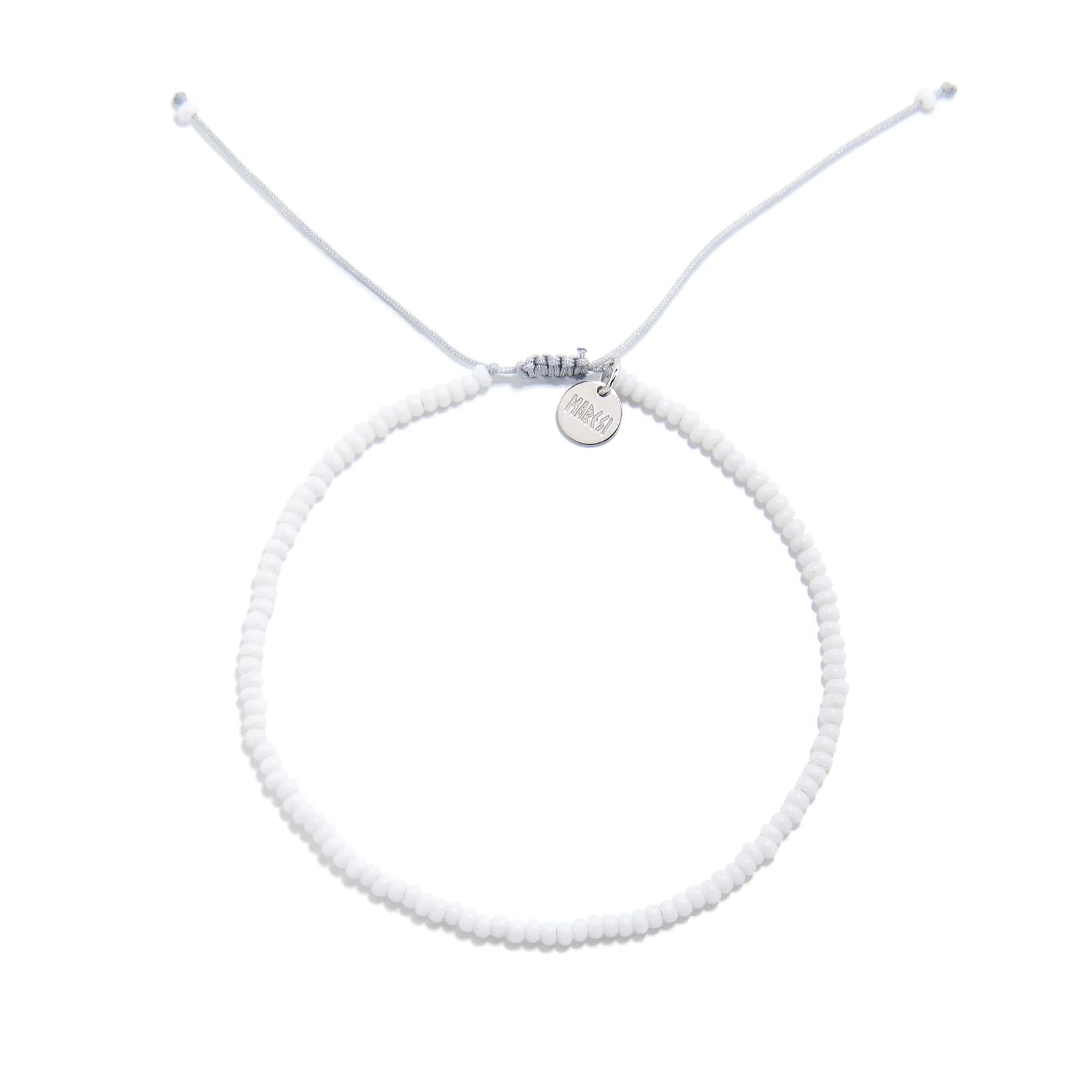 Small Beaded Bracelets shown from above with white seed beads with gray cord and round bracelet shape