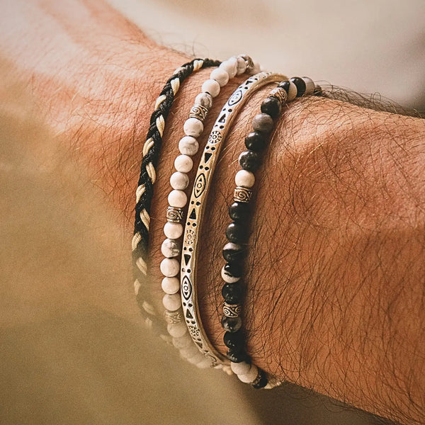 Stacked Bracelet Sets bracelet worn on wrist with stone beads and metal accents